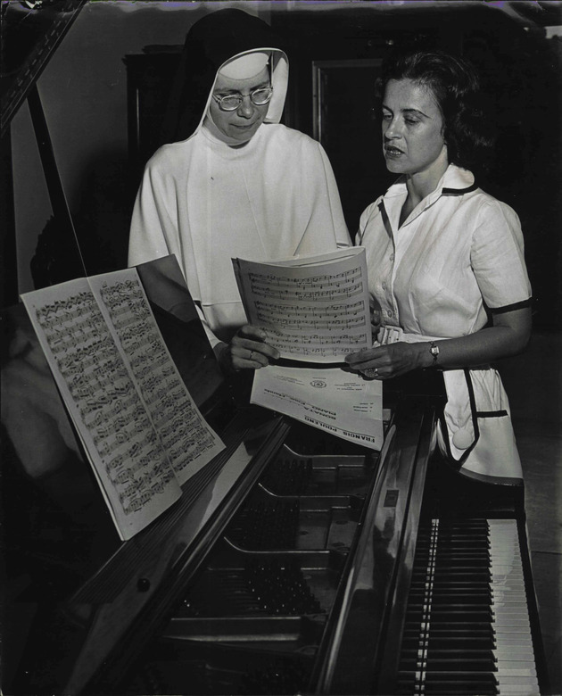 Sister Marie Rosaria and student Barbara Slate studying music scores